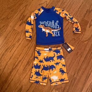 NWT Sinoly size 90–100 cm, 3T  or 4T swim outfit, with dinosaurs